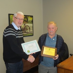 Executive Director of ANBLS presents a 50 year certificate to Don